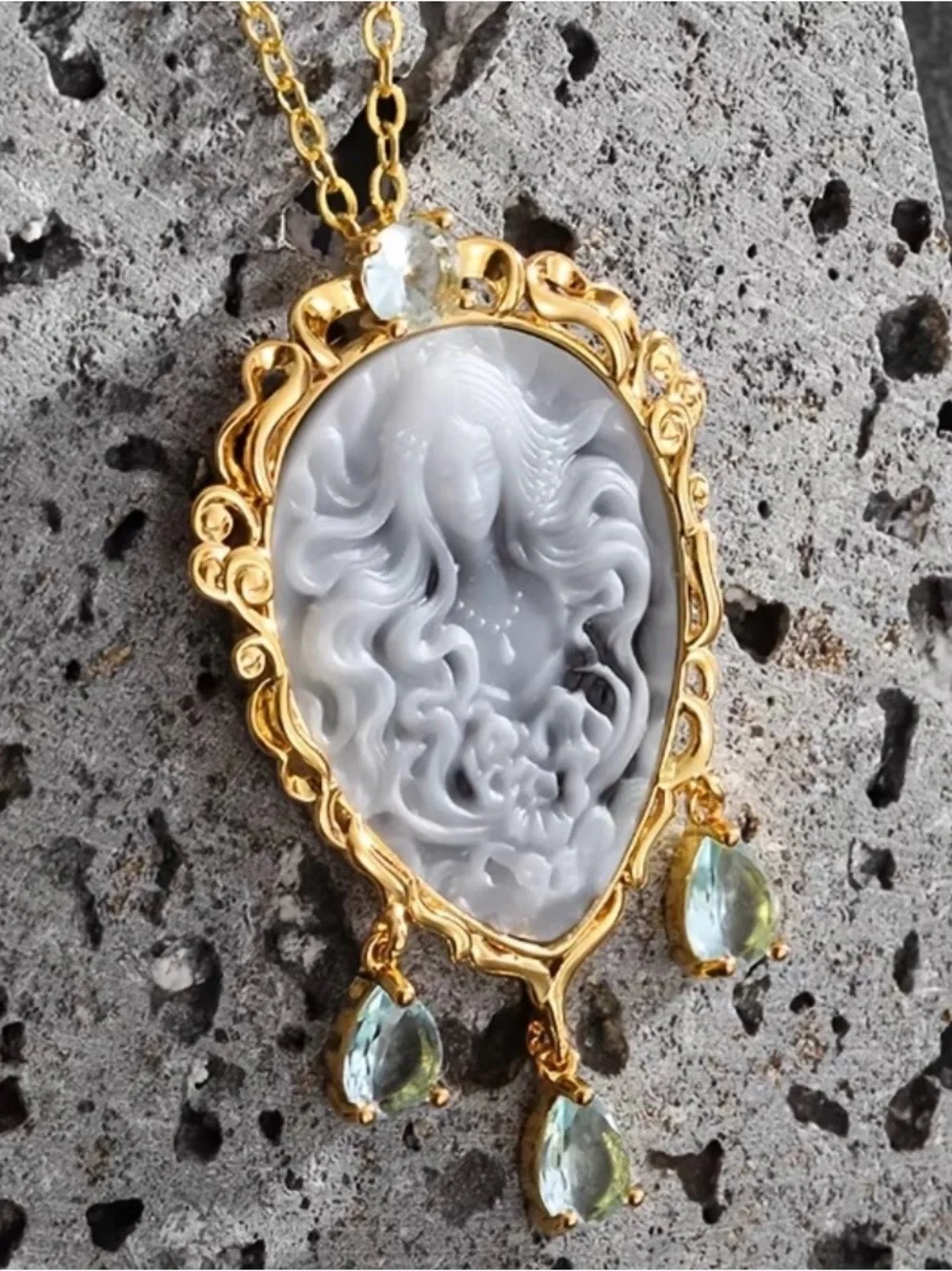 Gold Cameo Pendant Necklace with Gray Cameo and Light Blue Gem Drops